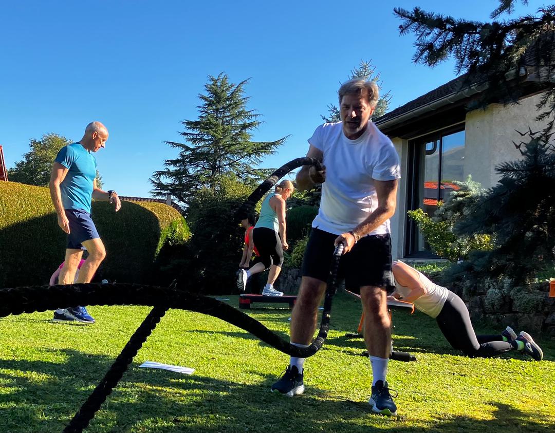 Group circuit training outdoors with Dave